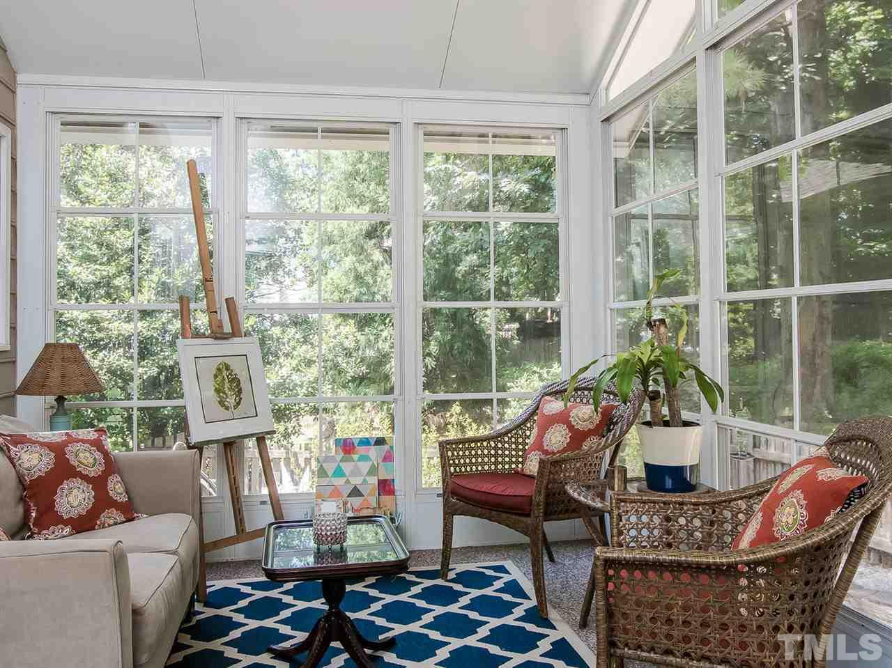 3400 Ribcowski Court Raleigh, NC 27616 - Photo 12 of 25 a living room with furniture and floor to ceiling windows