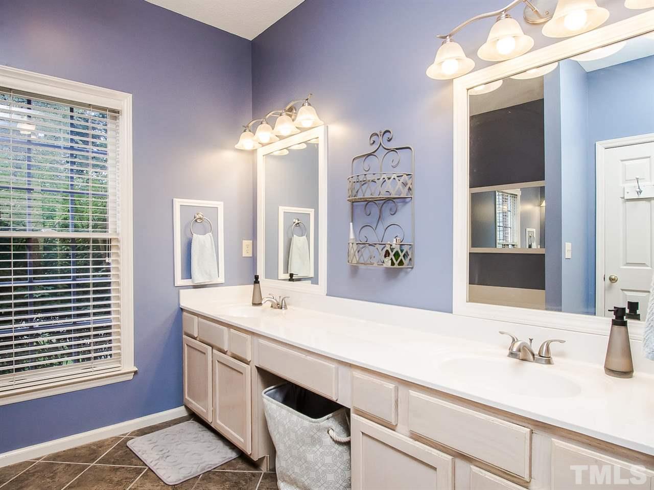 3400 Ribcowski Court Raleigh, NC 27616 - Photo 14 of 25 a bathroom with a sink double vanity and a mirror