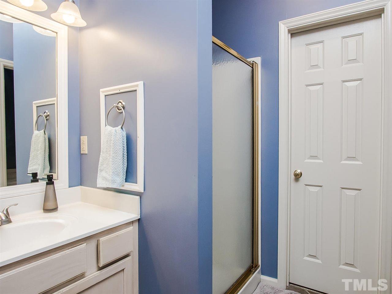 3400 Ribcowski Court Raleigh, NC 27616 - Photo 15 of 25 a bathroom with a sink vanity and a mirror