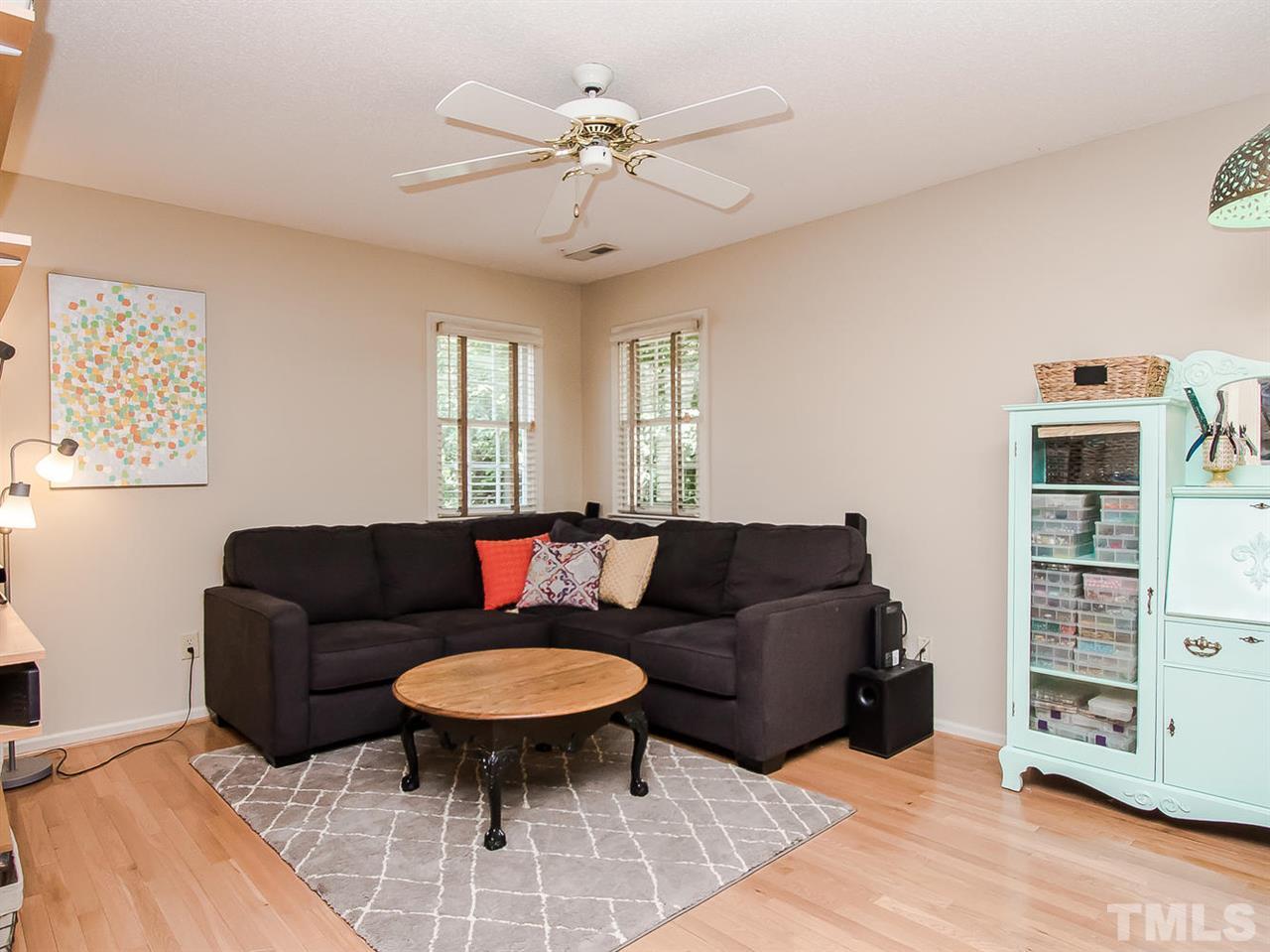 3400 Ribcowski Court Raleigh, NC 27616 - Photo 17 of 25 a living room with furniture and a wooden floor