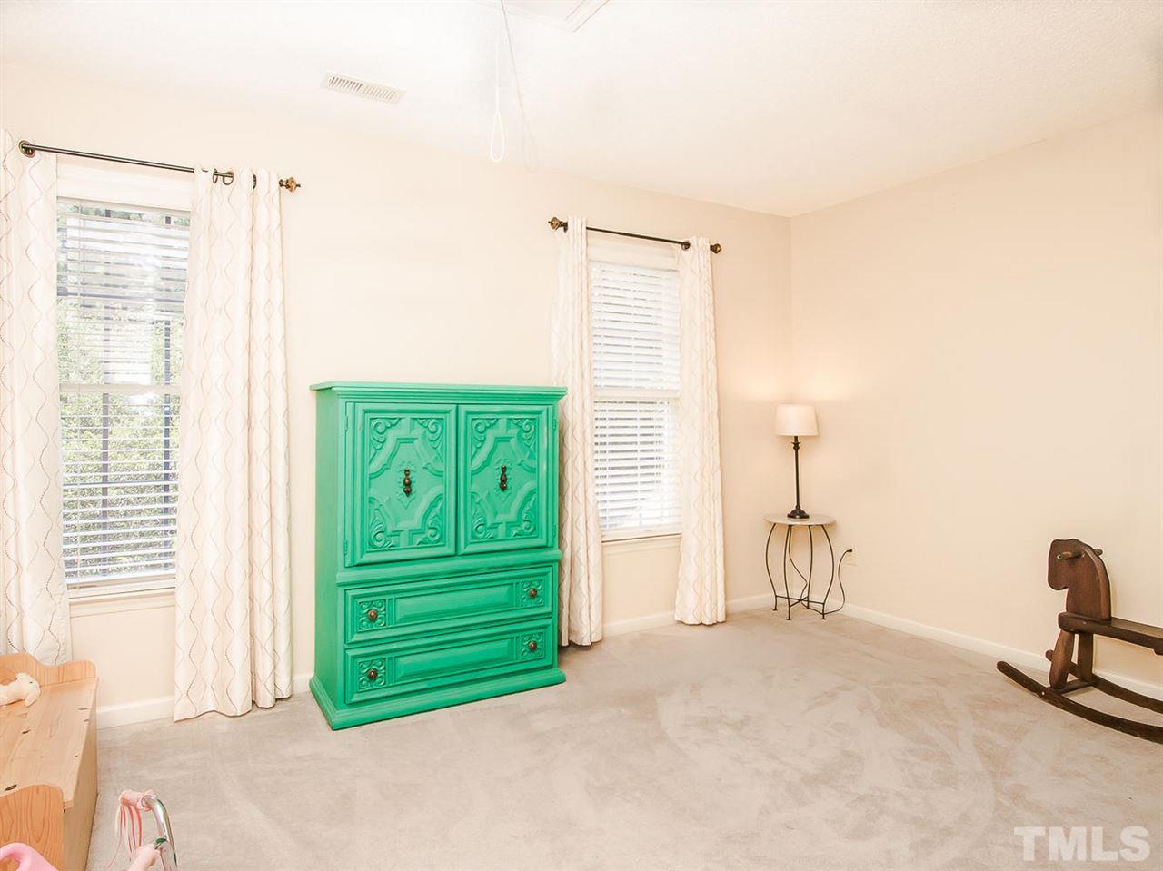 3400 Ribcowski Court Raleigh, NC 27616 - Photo 18 of 25 a view of a livingroom with a chair and a window