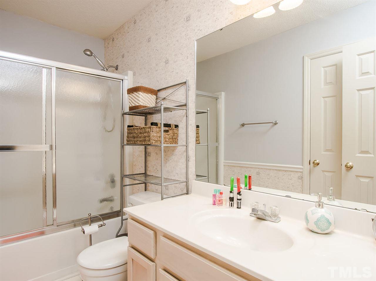3400 Ribcowski Court Raleigh, NC 27616 - Photo 19 of 25 a bathroom with a sink toilet and shower