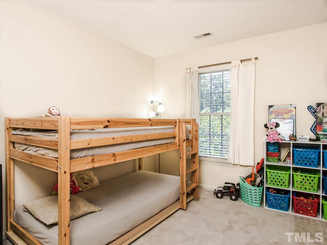 3400 Ribcowski Court Raleigh, NC 27616 - Photo 20 of 25 a bedroom with bunk bed and a window