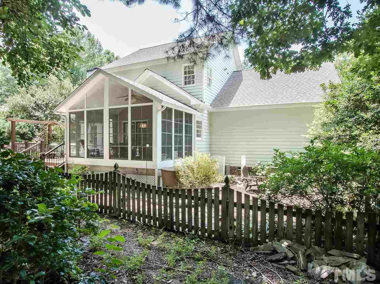 3400 Ribcowski Court Raleigh, NC 27616 - Photo 21 of 25 a front view of a house with a garden