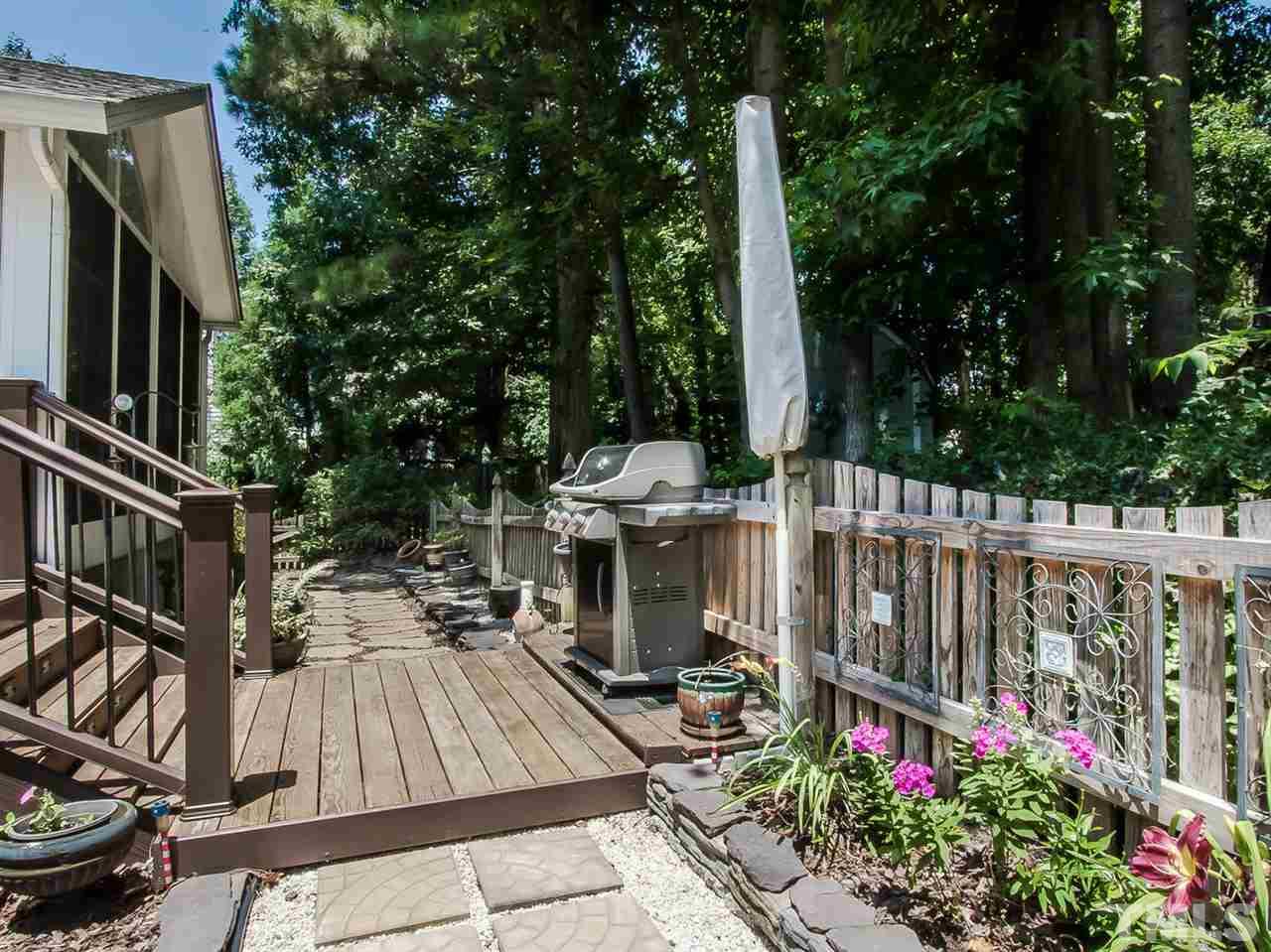 3400 Ribcowski Court Raleigh, NC 27616 - Photo 22 of 25 a view of outdoor space with garden and deck