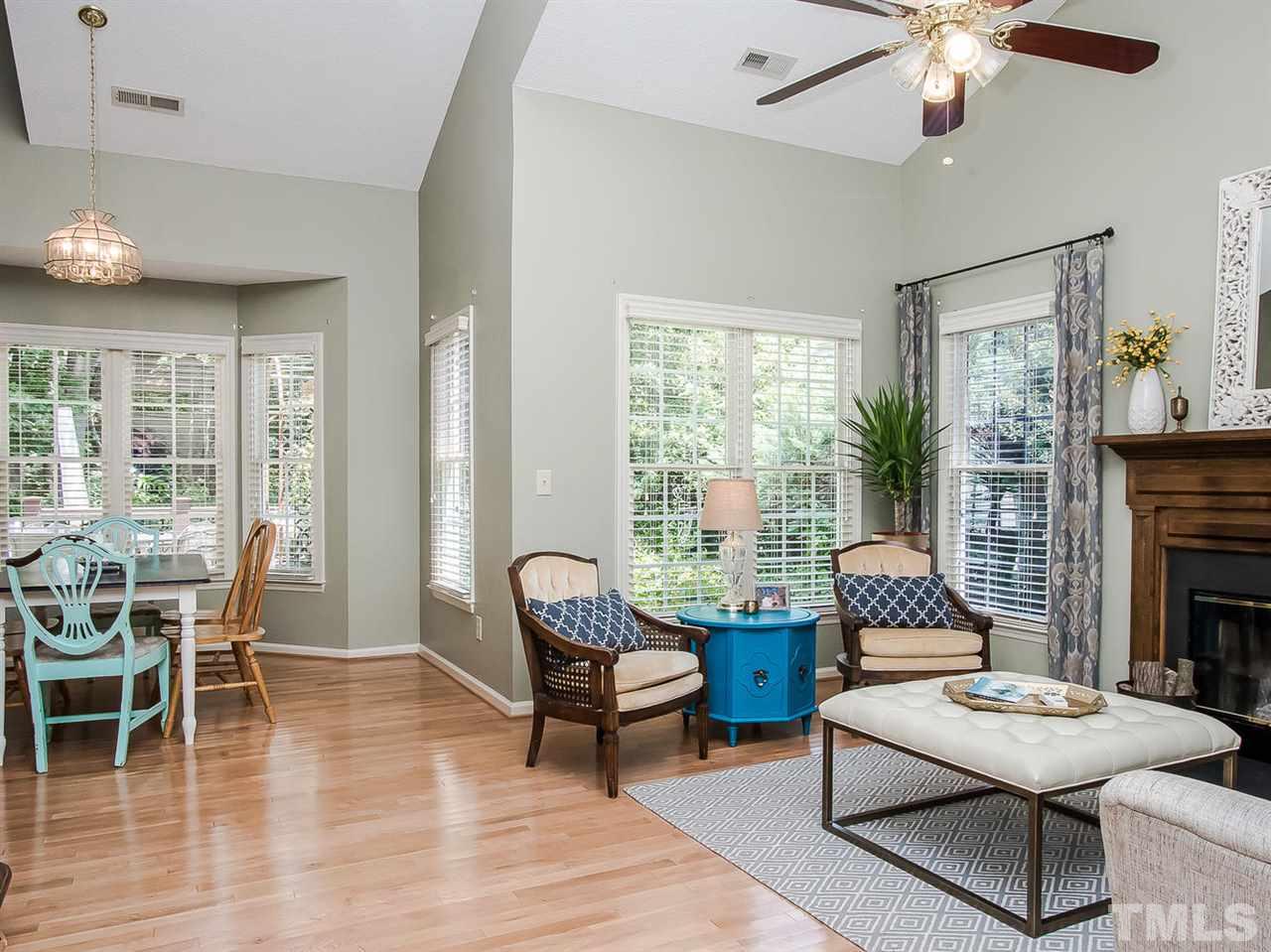 3400 Ribcowski Court Raleigh, NC 27616 - Photo 6 of 25 a living room with furniture and a fireplace