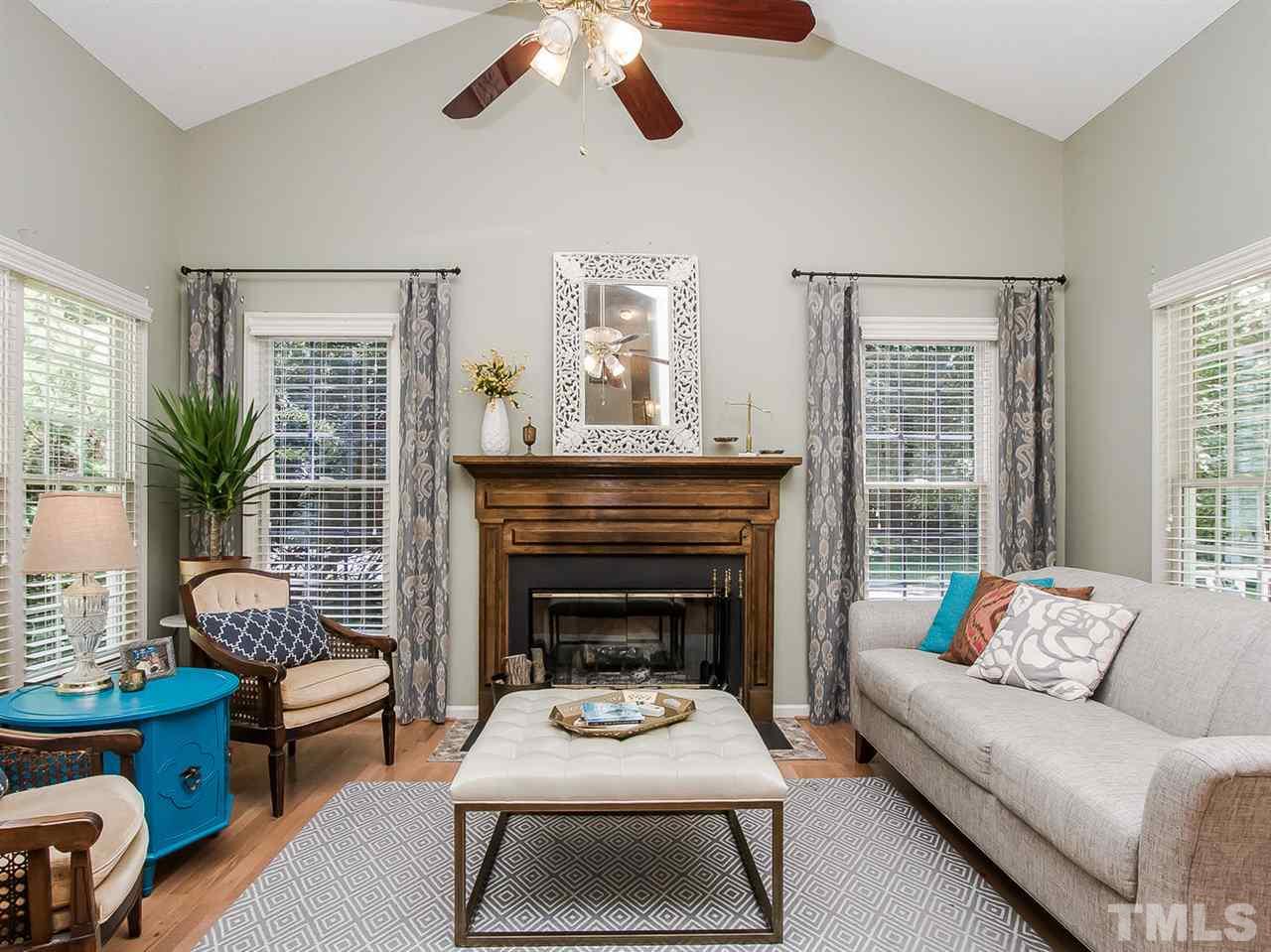 3400 Ribcowski Court Raleigh, NC 27616 - Photo 7 of 25 a living room with furniture and a fireplace