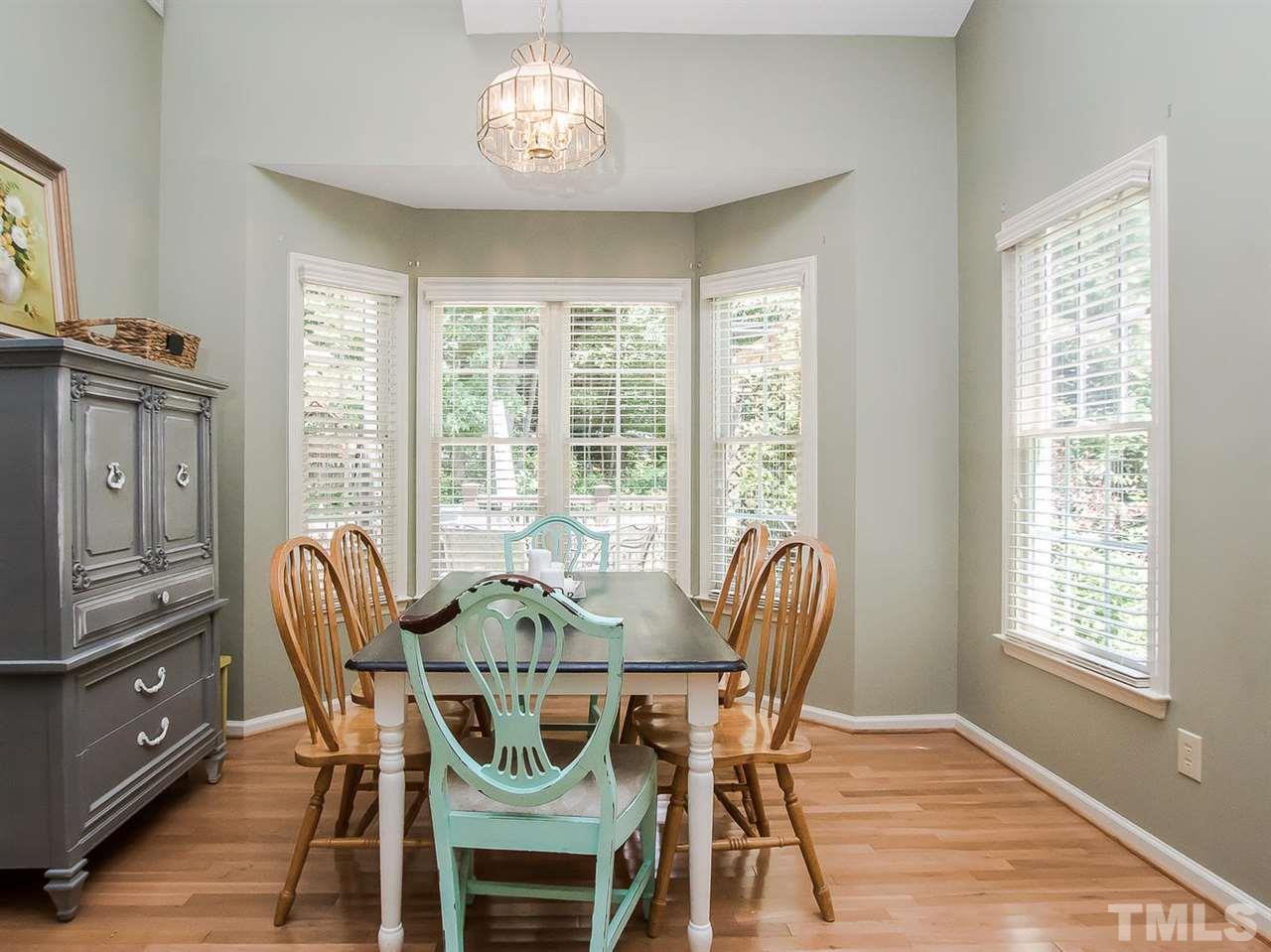 3400 Ribcowski Court Raleigh, NC 27616 - Photo 8 of 25 a view of a dining room with furniture window and wooden floor