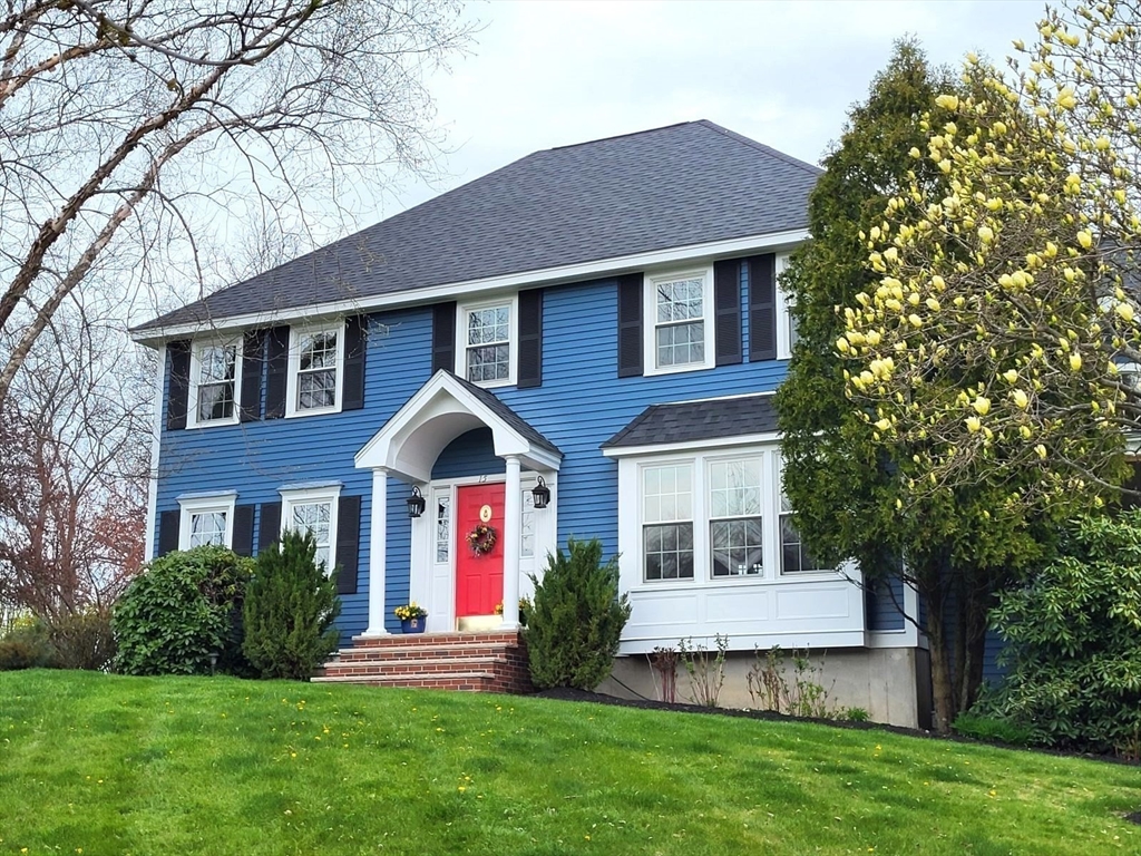 15 Mansfield Road Middleton, MA 01949 - Photo 1 of 42 a front view of a house with a yard and trees