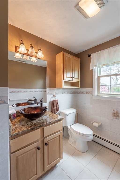 15 Mansfield Road Middleton, MA 01949 - Photo 13 of 42 a bathroom with a granite countertop toilet sink and mirror