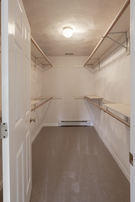 15 Mansfield Road Middleton, MA 01949 - Photo 17 of 42 a view of a room with racks on the wall