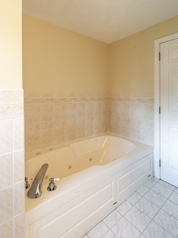 15 Mansfield Road Middleton, MA 01949 - Photo 28 of 42 a bathroom with a tub and a shower