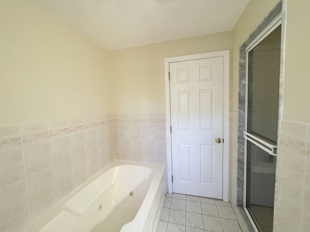 15 Mansfield Road Middleton, MA 01949 - Photo 29 of 42 a bathroom with a bathtub and shower