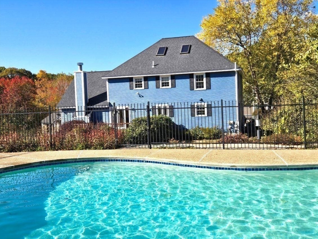 15 Mansfield Road Middleton, MA 01949 - Photo 37 of 42 a front view of a house with a yard and trees