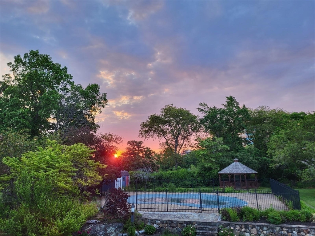 15 Mansfield Road Middleton, MA 01949 - Photo 39 of 42 a backyard of a house with table and chairs