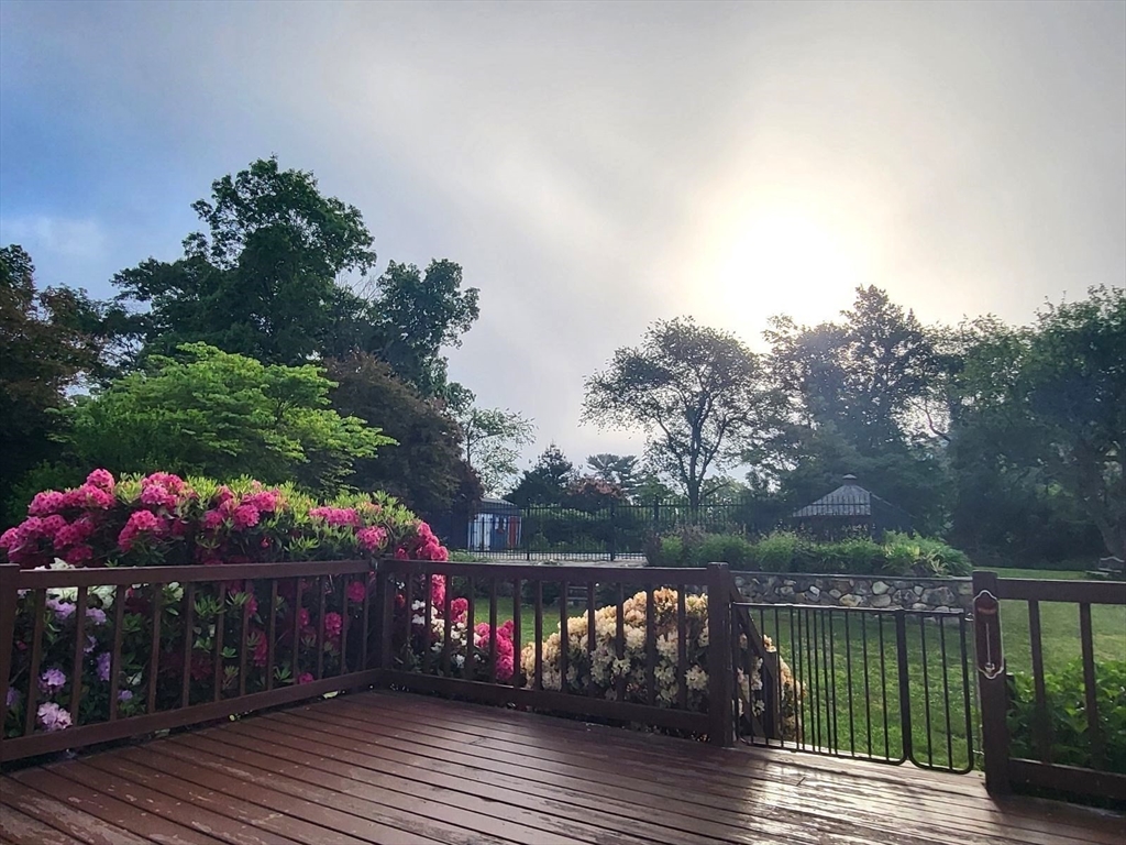 15 Mansfield Road Middleton, MA 01949 - Photo 40 of 42 a view of a table and chairs on roof deck