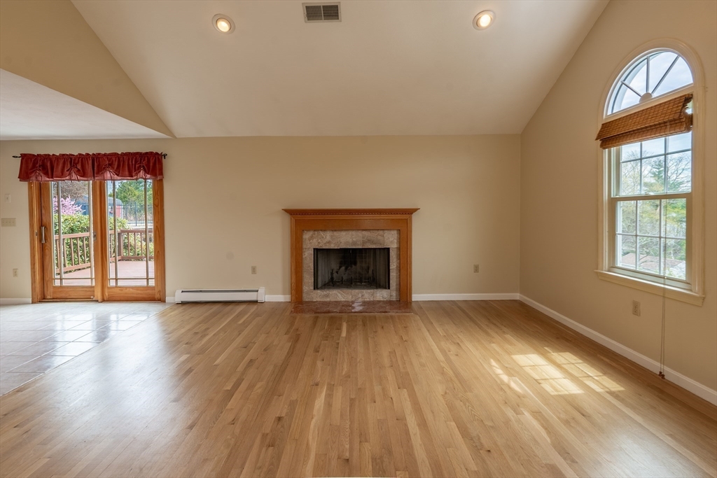 15 Mansfield Road Middleton, MA 01949 - Photo 7 of 42 a view of an empty room with a window and wooden floor