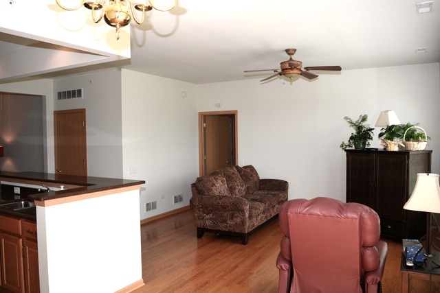 13631 Hemlock Road Huntley, IL 60142 - Photo 3 of 12 a living room with furniture and a flat screen tv