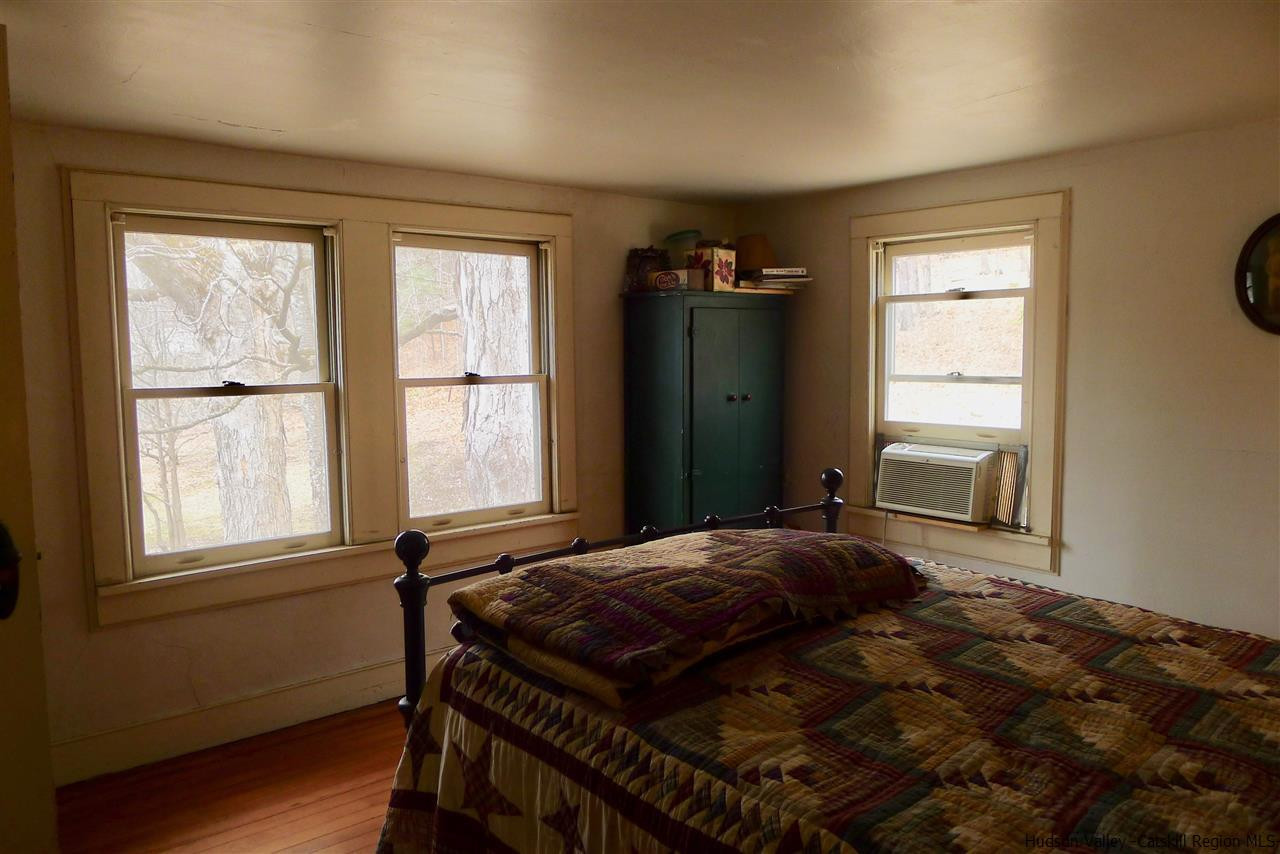 45 Upper Whitfield Road Accord, NY 12404 - Photo 11 of 18 a bedroom with a bed and a window