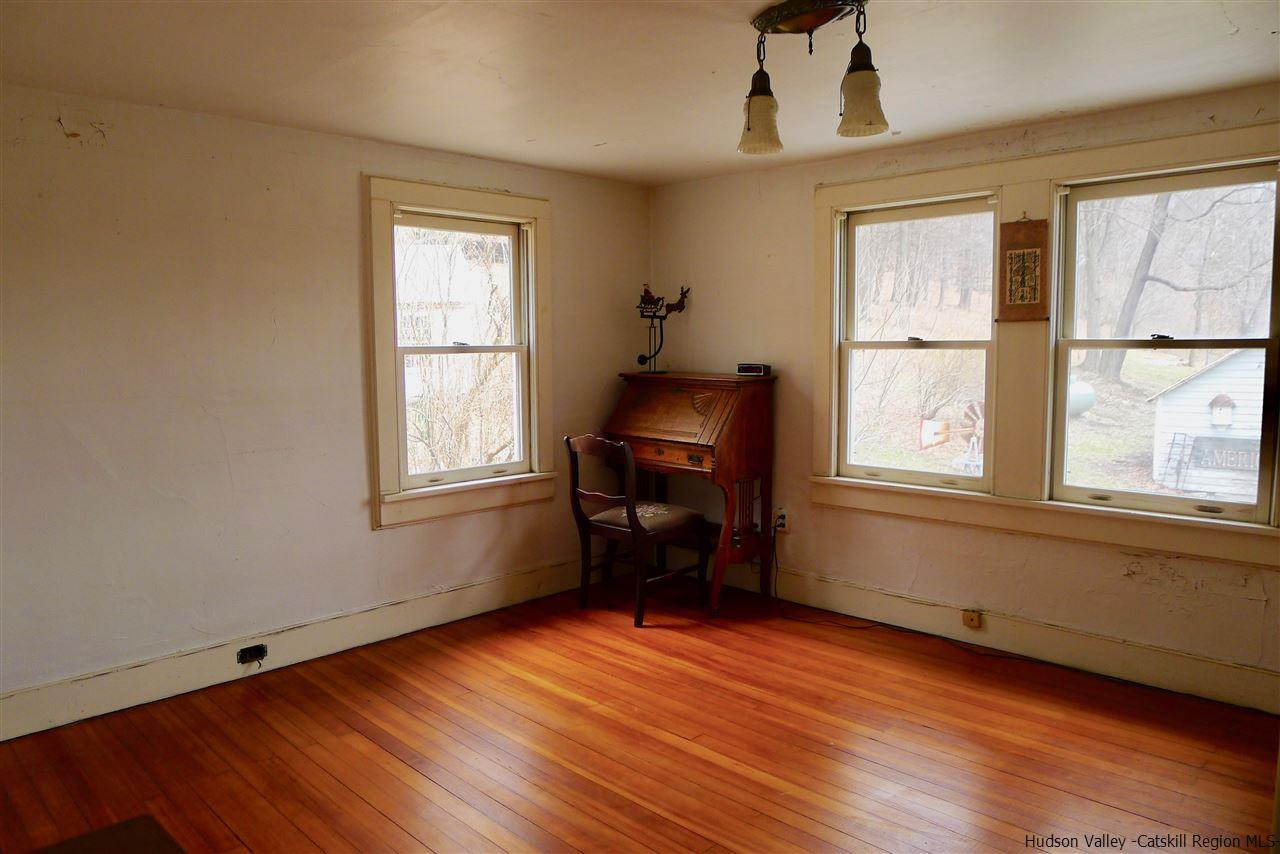 45 Upper Whitfield Road Accord, NY 12404 - Photo 12 of 18 a living room with furniture and a window