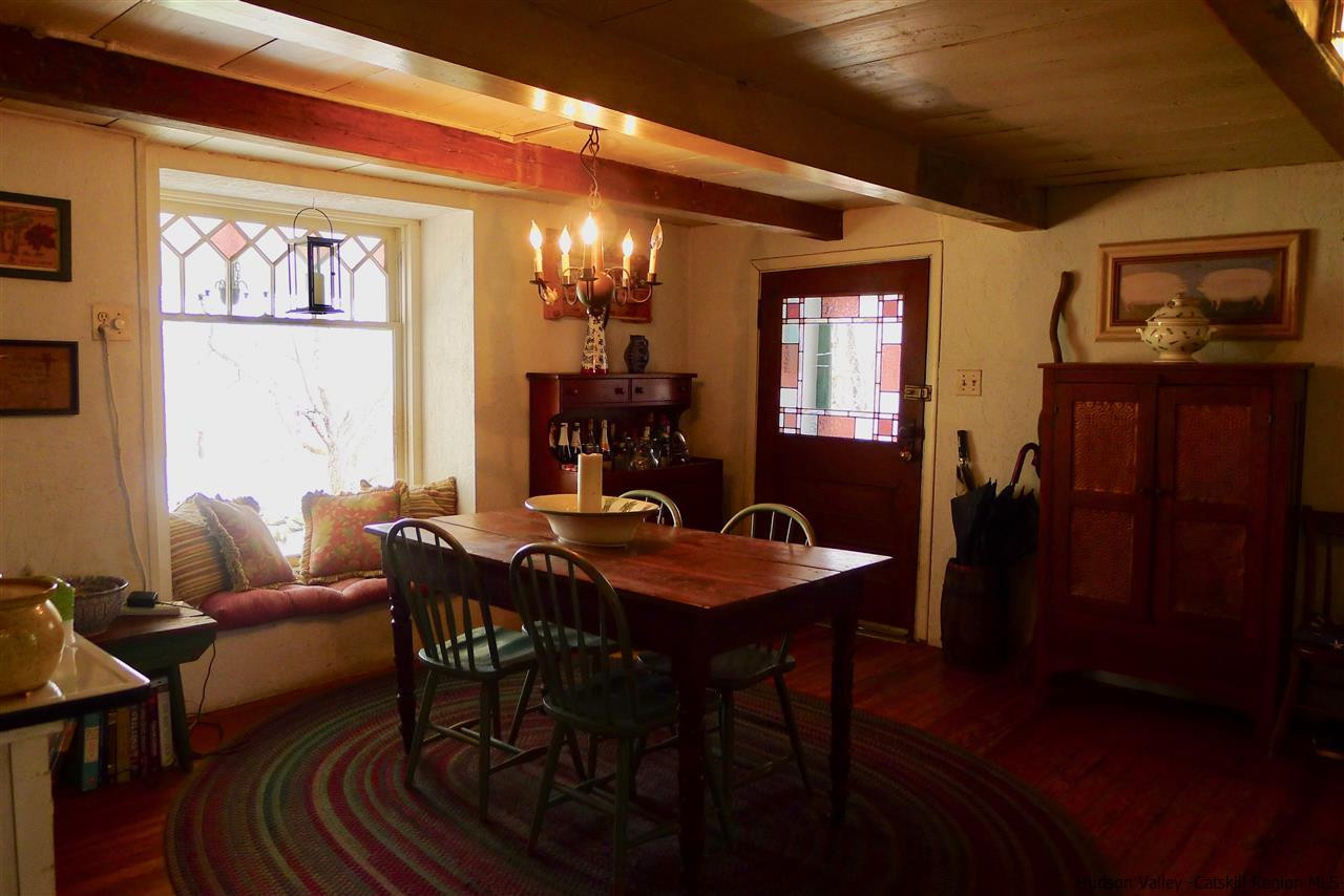 45 Upper Whitfield Road Accord, NY 12404 - Photo 8 of 18 a view of a dining room with furniture and chandelier