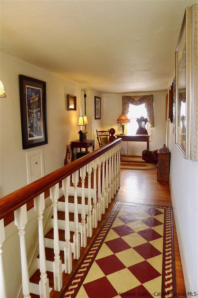 45 Upper Whitfield Road Accord, NY 12404 - Photo 9 of 18 a view of a hallway with wooden floor and furniture