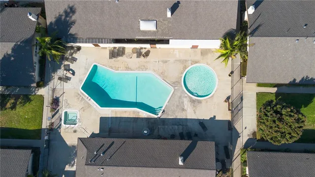 an aerial view of a house with a swimming pool