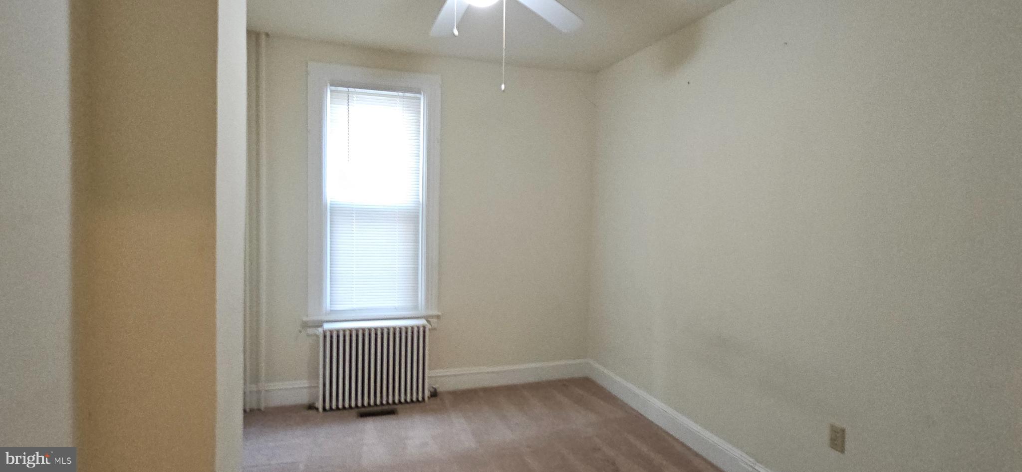 434 Fairmont Avenue, Unit 1 Winchester, VA 22601 - Photo 6 of 15 an empty room with a window