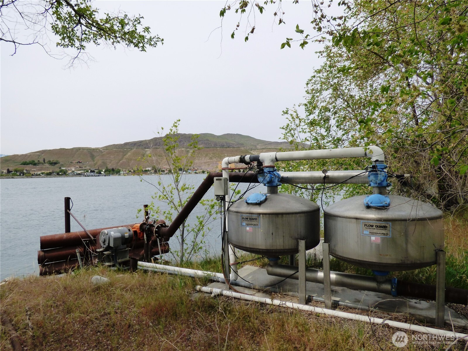 0 Bailey Way Brewster, WA 98812 - Photo 13 of 17 a backyard of a house with table and chairs