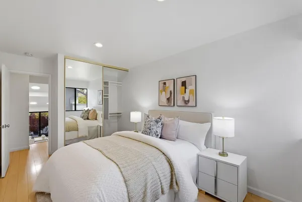 a bedroom with a bed and a lamp