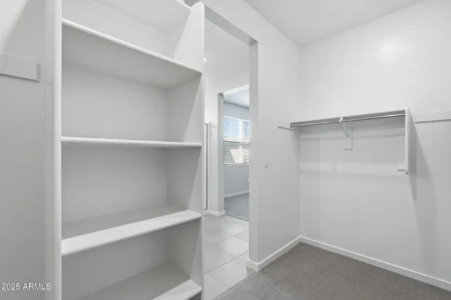 a view of an empty walk in closet