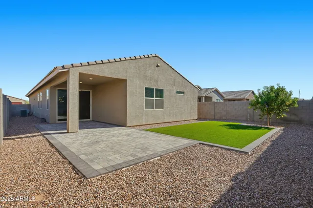 a view of a backyard with a small cabin