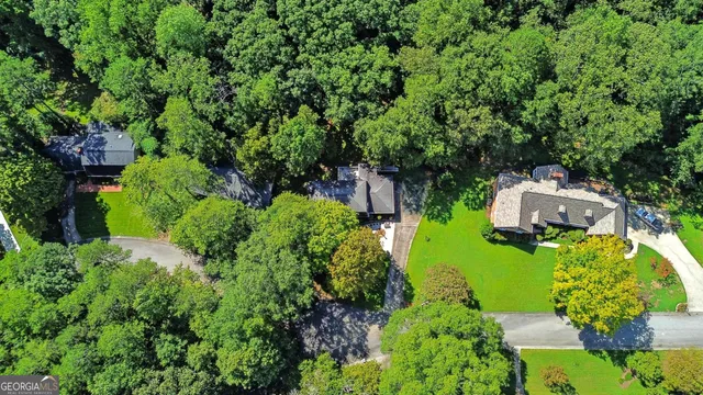an aerial view of house with yard