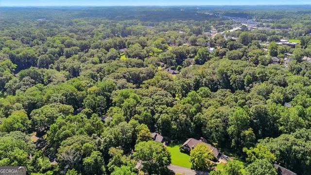 an aerial view of a houses with a yard