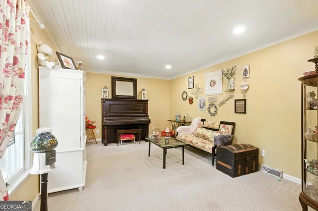 a living room with furniture flat screen tv and a fireplace