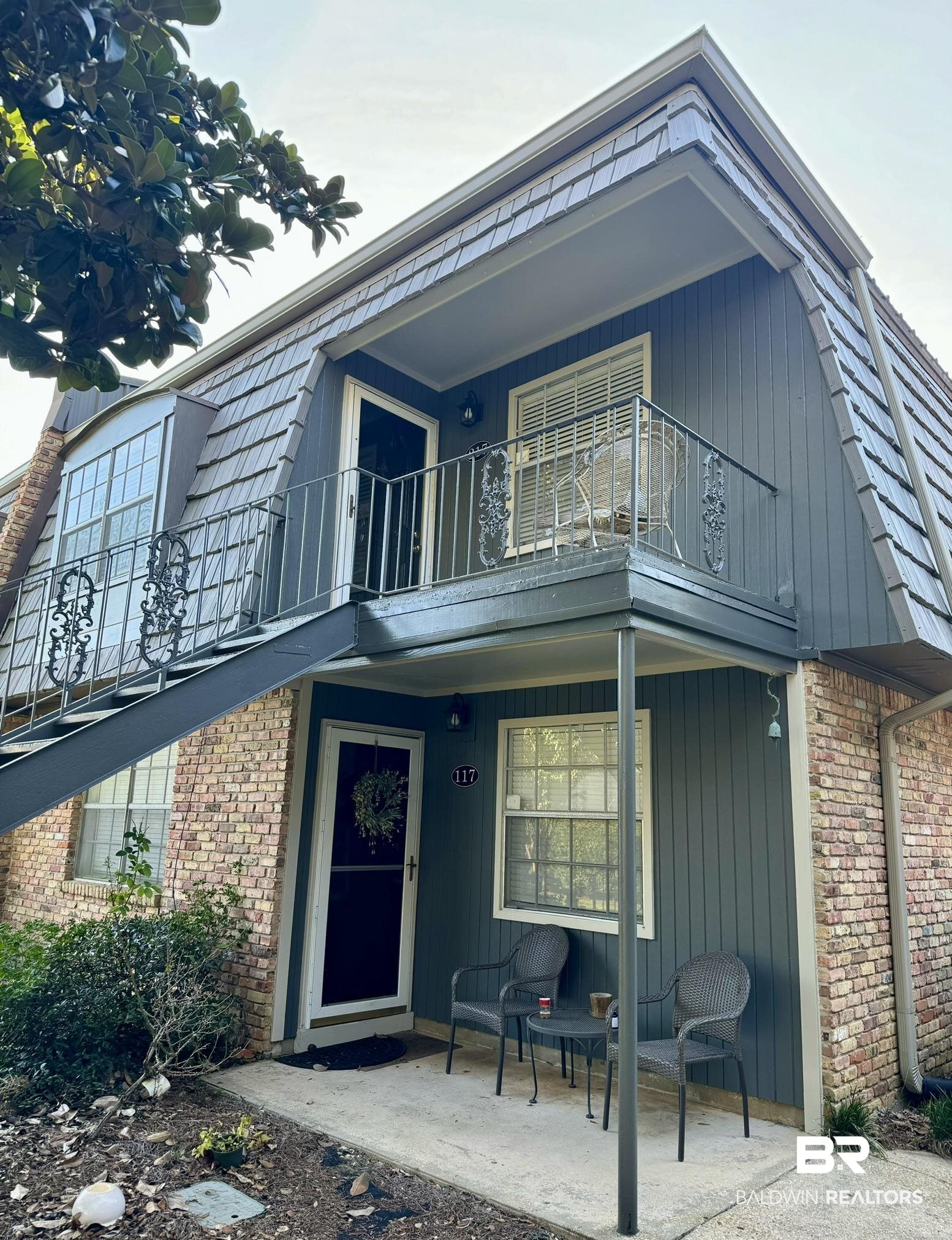 207 South Mobile Street, Unit 217 Fairhope, AL 36532 - Photo 5 of 8 Back of property featuring a balcony and a patio