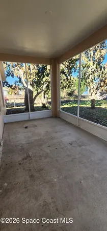 a view of a room with a large window