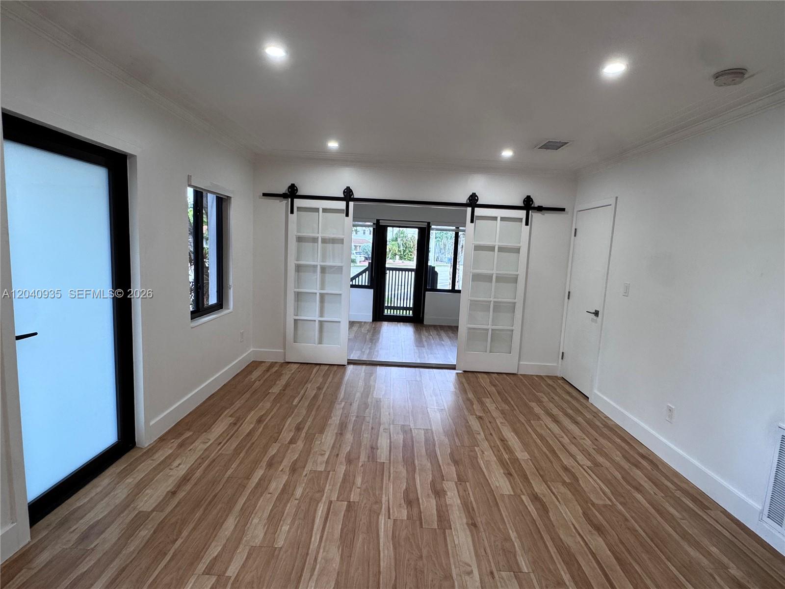 375 Southwest 32nd Road Miami, FL 33129 - Photo 29 of 44 a view of empty room with wooden floor