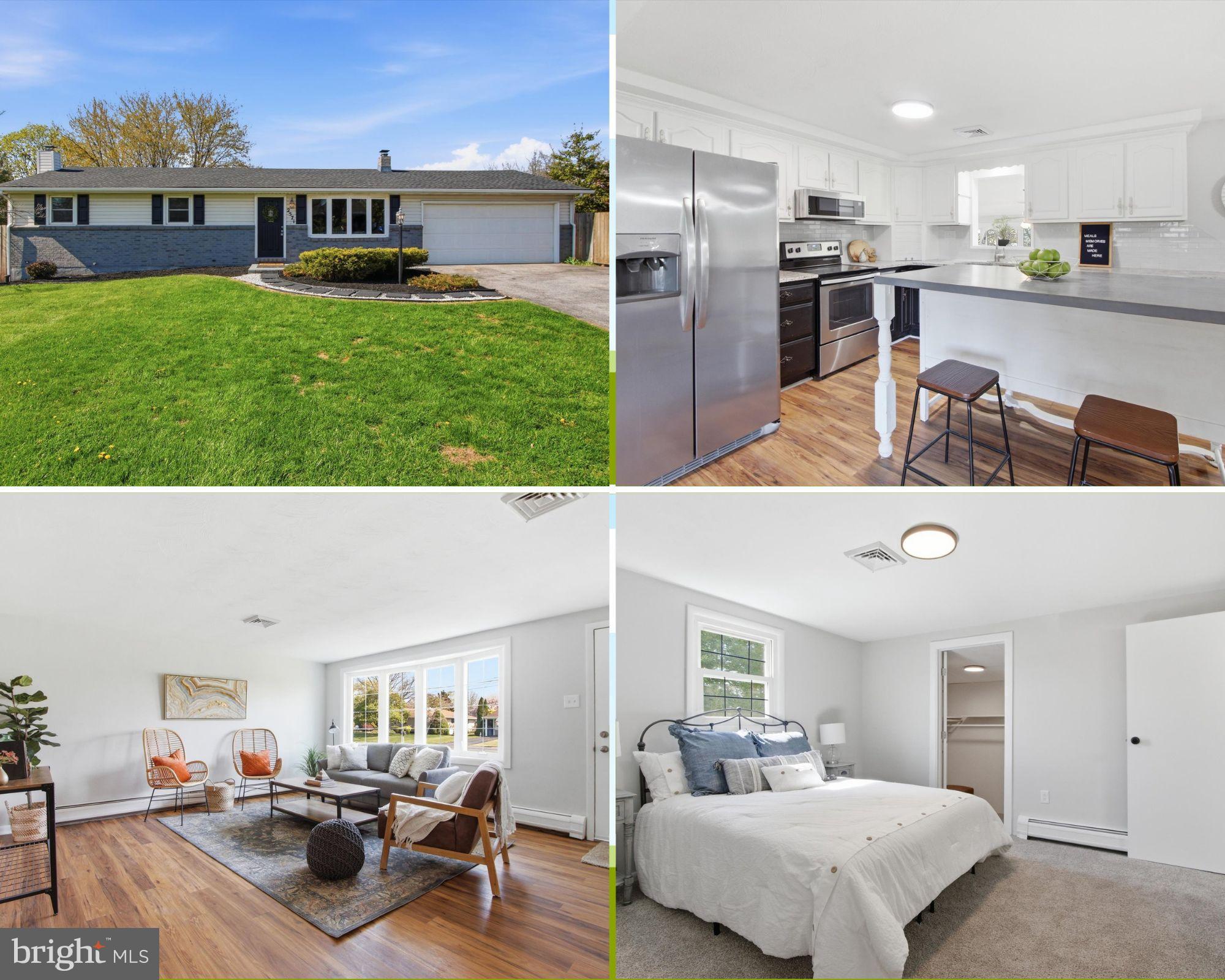 a living room with furniture and a kitchen view