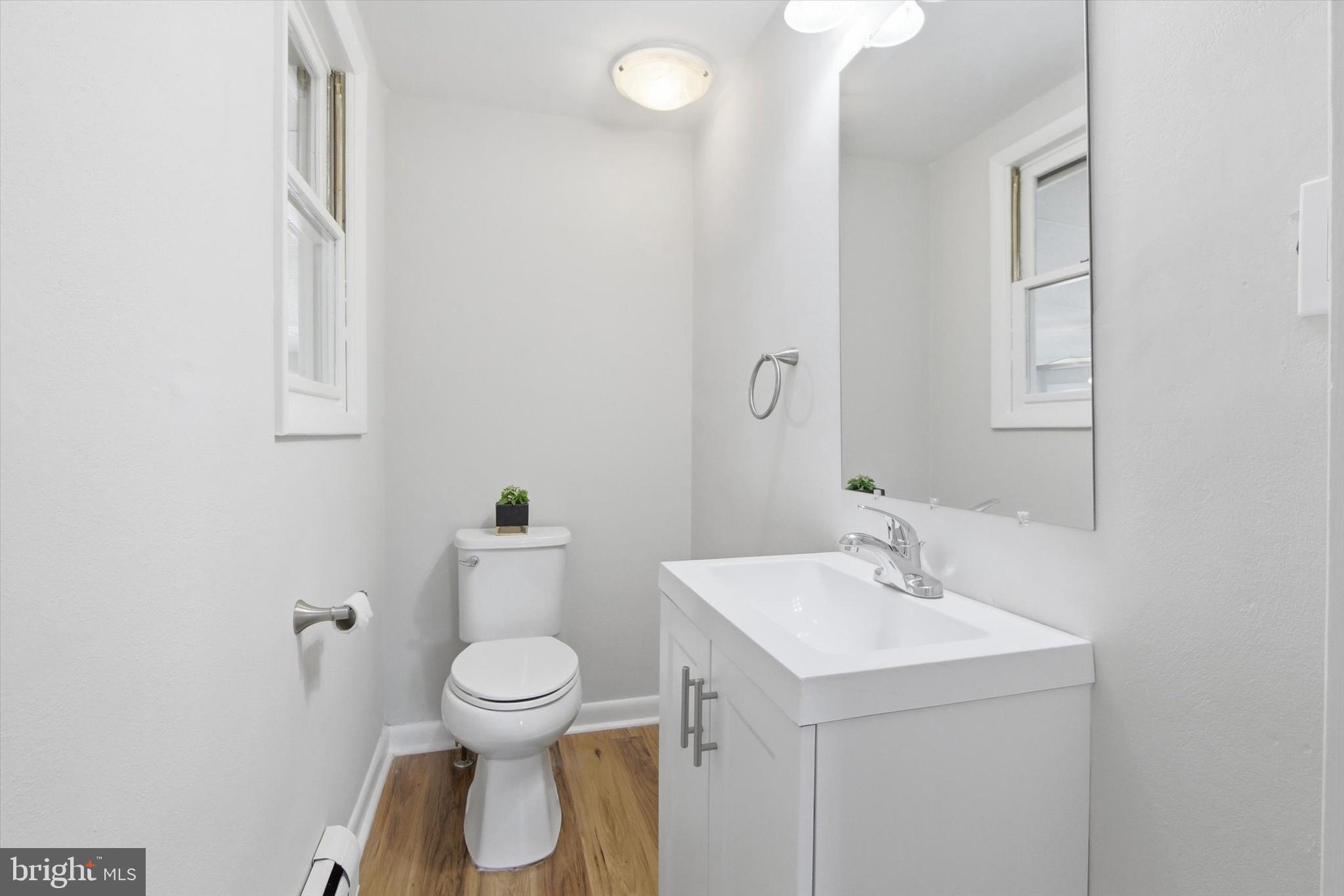 2571 Locust Road Dover, PA 17315 - Photo 13 of 27 a bathroom with a toilet sink and mirror
