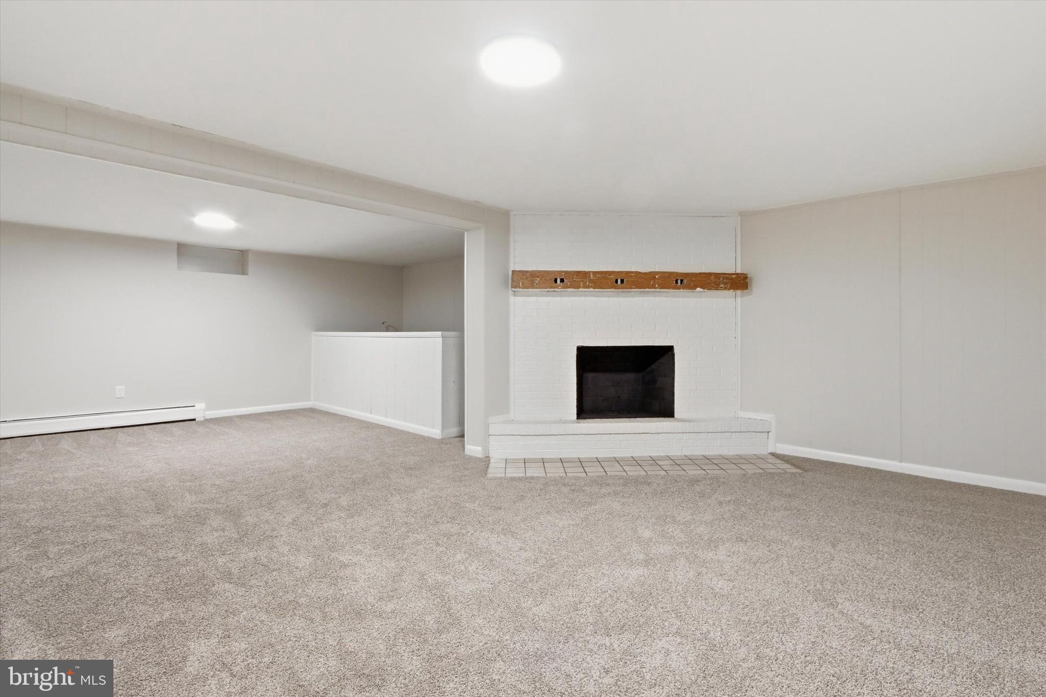 2571 Locust Road Dover, PA 17315 - Photo 19 of 27 a view of an empty room with a fireplace and a window