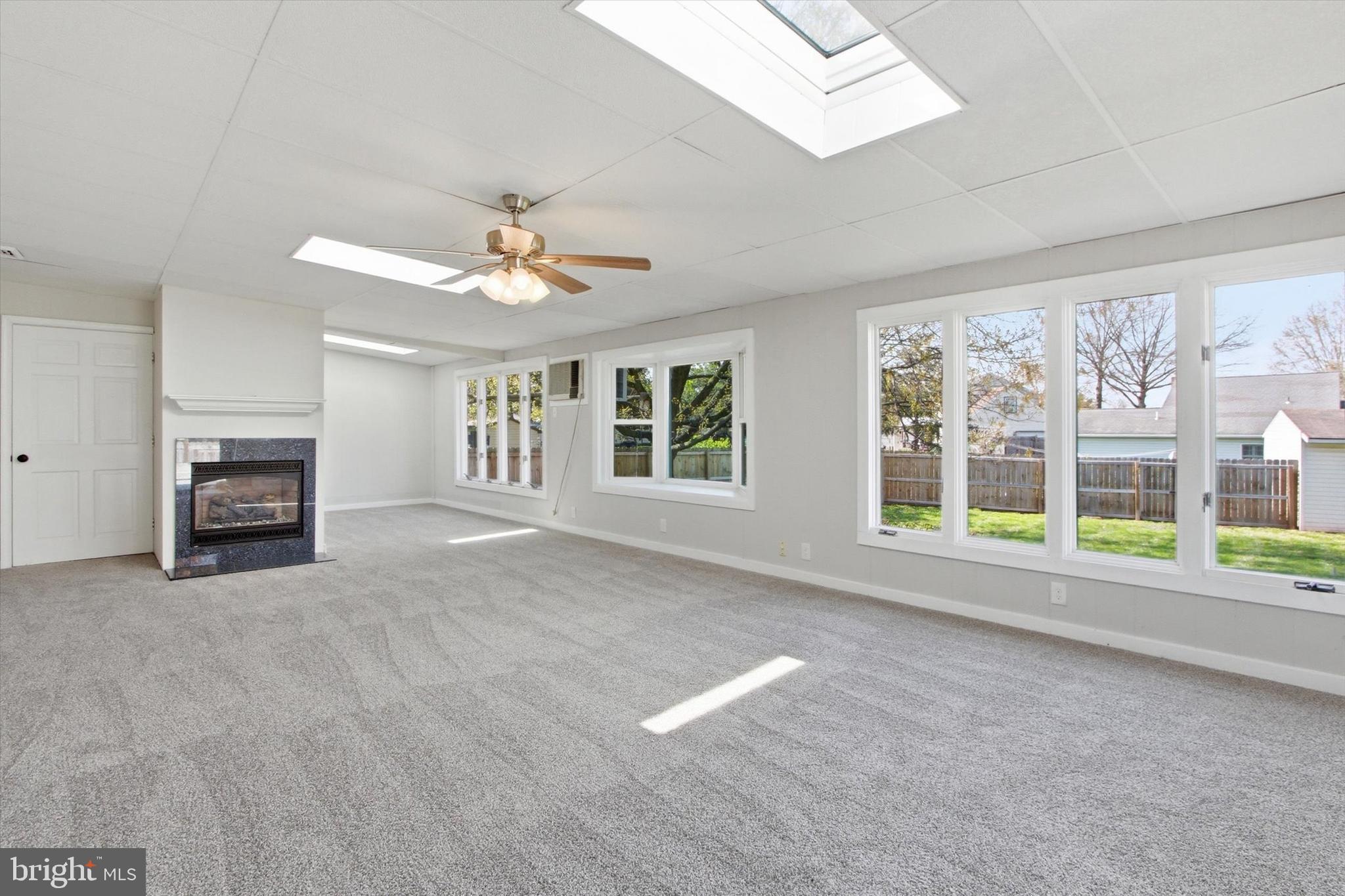 2571 Locust Road Dover, PA 17315 - Photo 8 of 27 a view of an empty room with a window and a kitchen