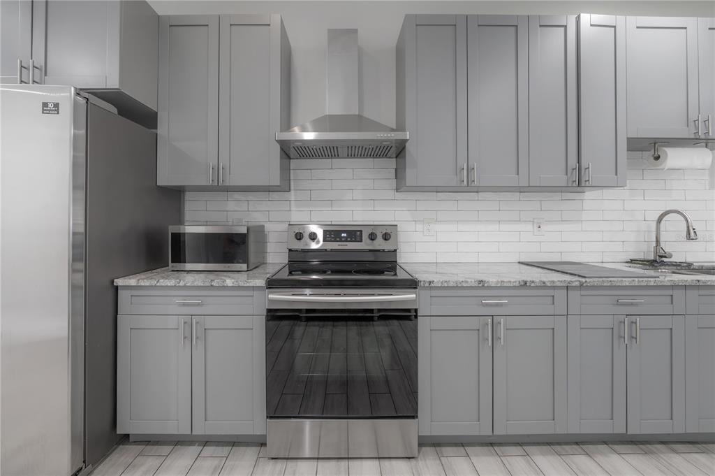 2341 West Chestnut Street Tampa, FL 33607 - Photo 10 of 42 a kitchen with cabinets appliances and a sink
