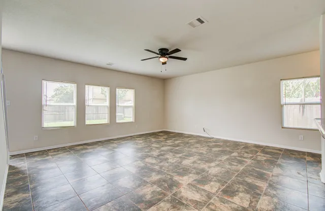 a view of an empty room with a window