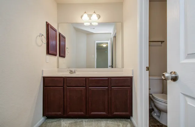 a white bath tub sitting next to a white toilet