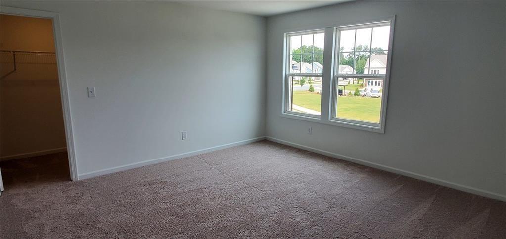 334 Silverleaf Trail Bethlehem, GA 30620 - Photo 11 of 30 an empty room with a window