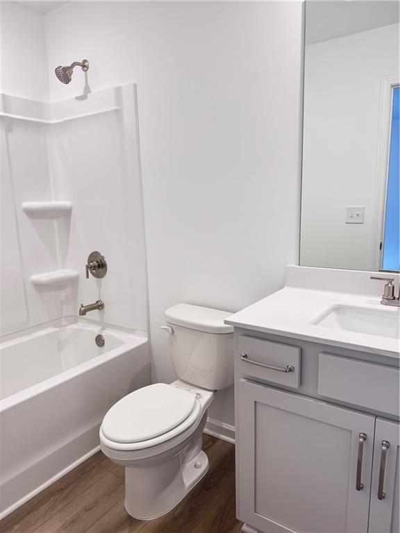 334 Silverleaf Trail Bethlehem, GA 30620 - Photo 13 of 30 a bathroom with a toilet a sink and a bathtub