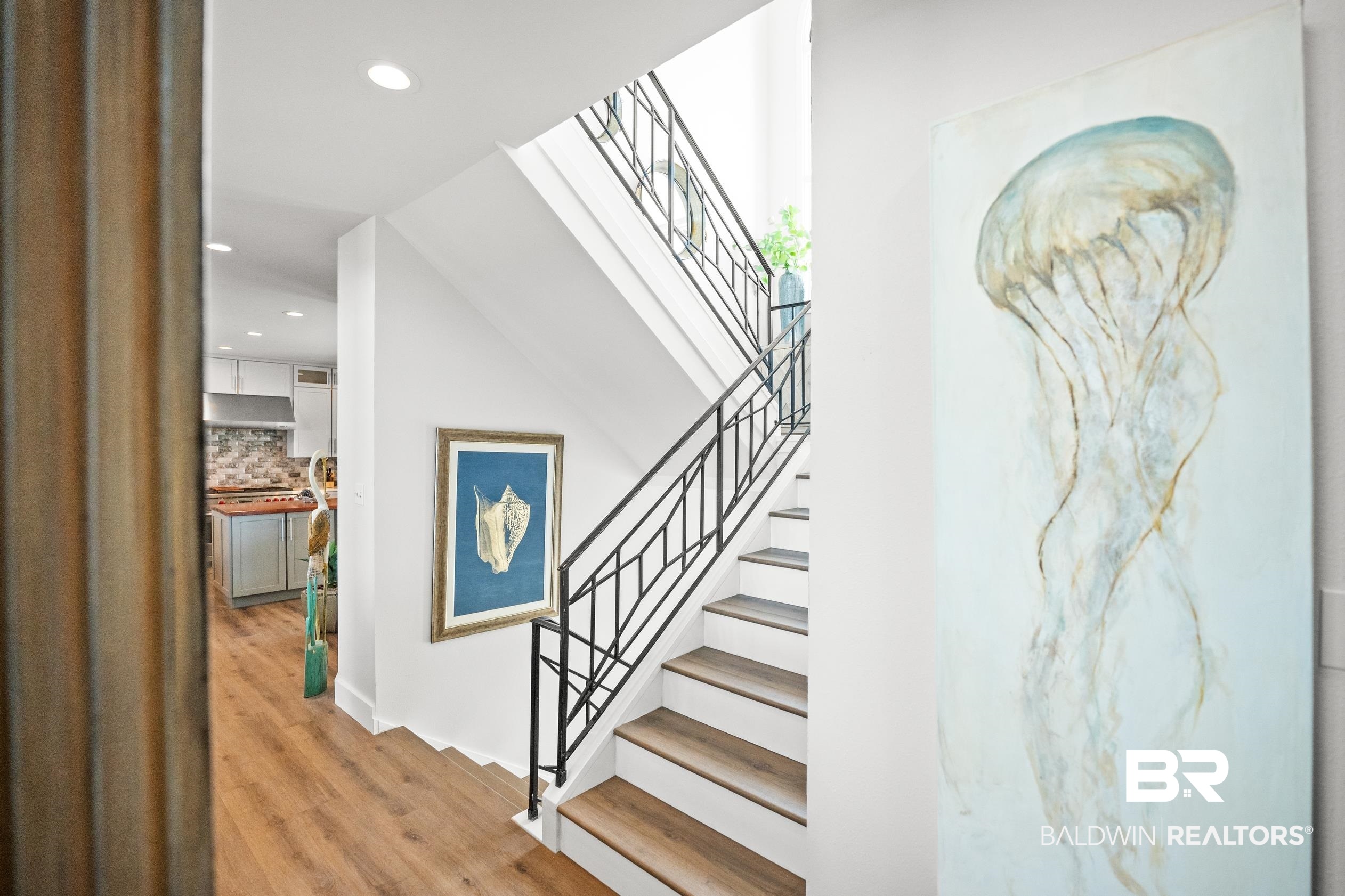 30954 River Road Orange Beach, AL 36561 - Photo 10 of 59 Stairs featuring recessed lighting and wood finished floors