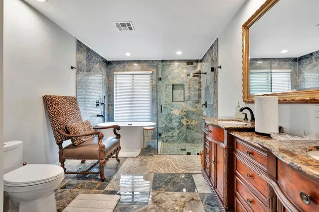 a living room with furniture a rug and a toilet