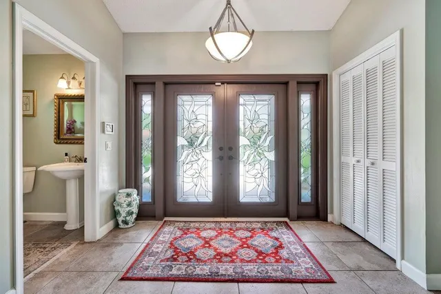 a view of an entryway with a front door